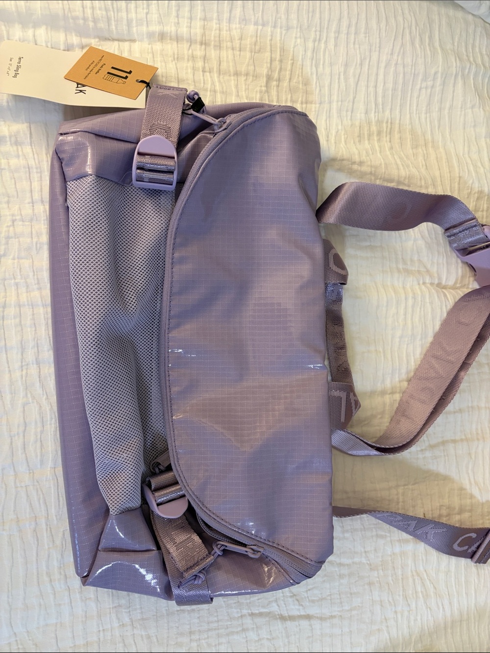 NWT Calpak Terra Sling Bag in Amethyst. Brand new. Never used.